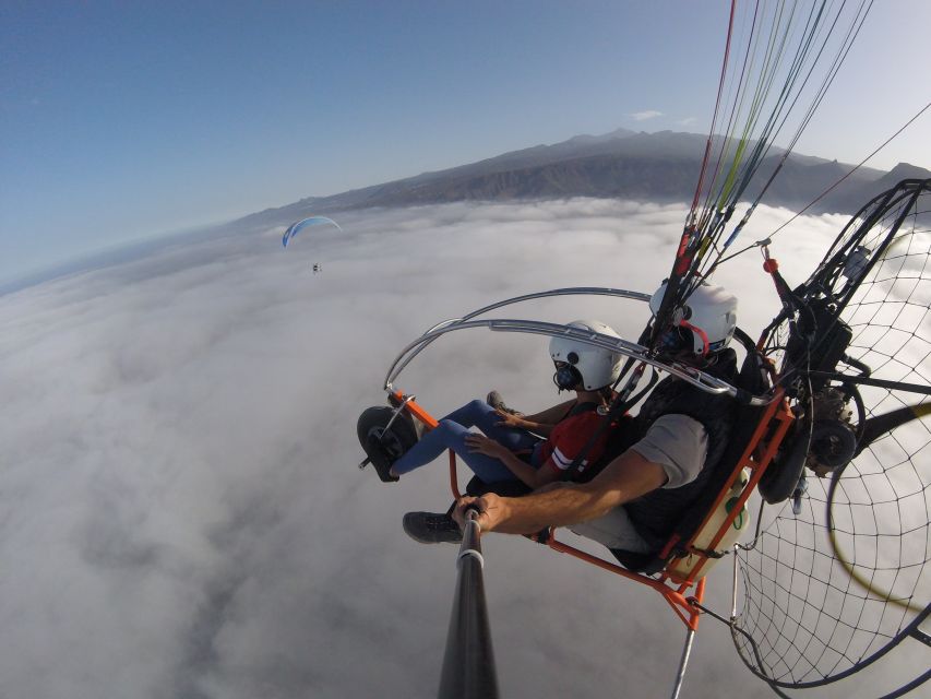 Adeje: Paratrike Flying Tour with Hotel Pickup and Photos - Puerto Colón and the seven-minute coastal pass