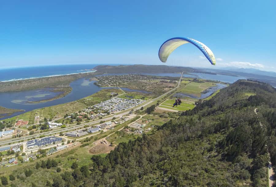 Adventure Tandem Paragliding Flight - Preparing for takeoff with a tandem pilot