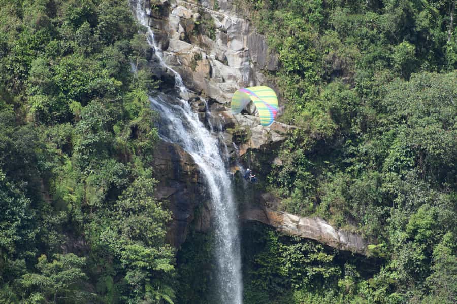 From Medellín: Paragliding and Rafting Combo Tour - From Medellín to an Antioquian canyon