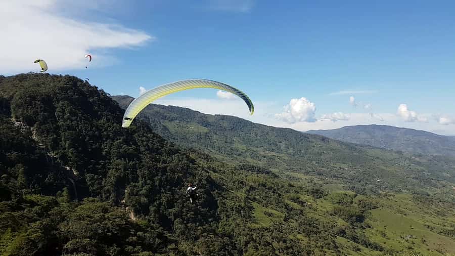 From Medellin: Private Paragliding Tour Over Waterfalls - Flying above Cocorna’s canyon country