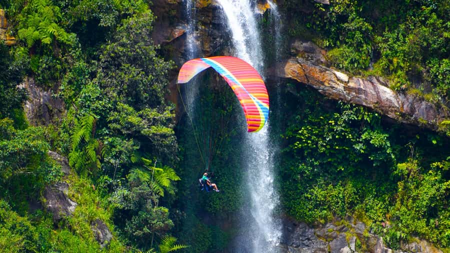 From Medellin: Private Paragliding Tour Over Waterfalls - What the tandem flight feels like in practice
