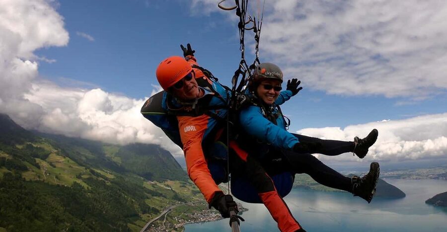 Lucerne: Unique Tandem Paragliding Experience - Getting ready with the pilot