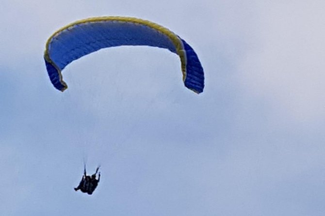 paragliding at the mountains with hotel pickup - Getting ready for a tandem flight