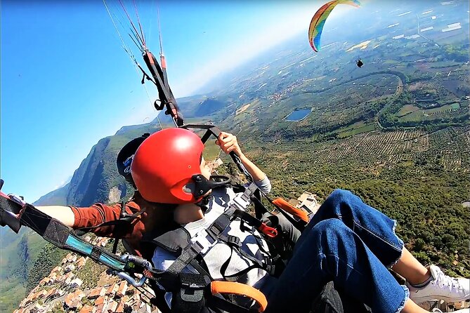 Paragliding flight over the Gardens of Ninfa - Flying above Ninfa from ancient Norma