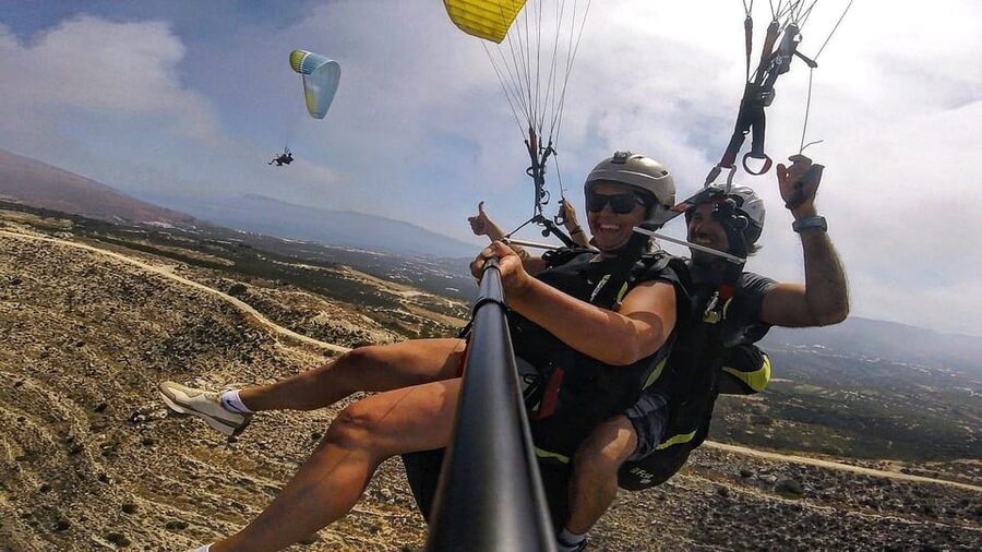 Paragliding in Chania - Getting ready beside the pilot