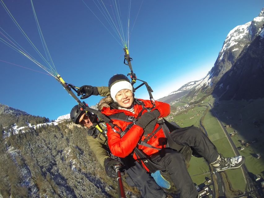 Stans: Tandem Paragliding Experience - Landing in the valley and returning to the station