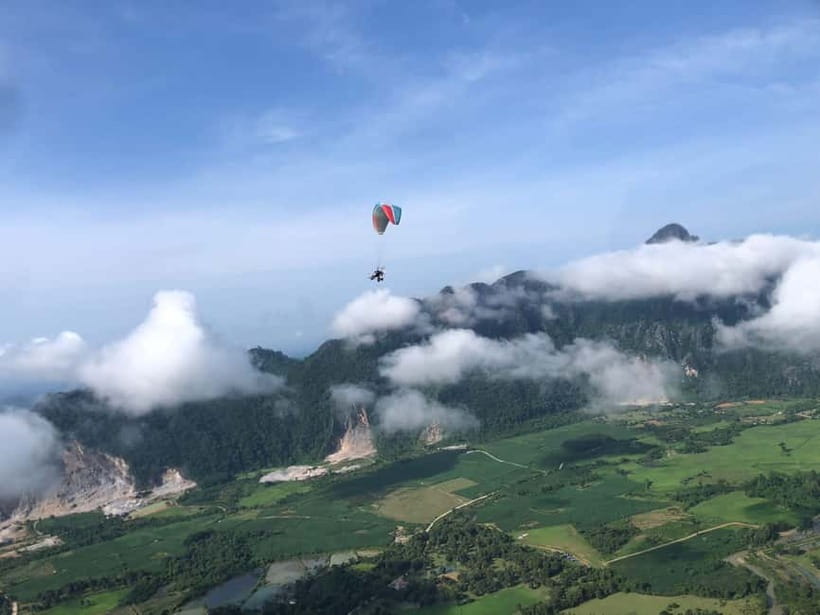 Vang Vieng: Paragliding Experience with Hotel Pickup - Flying over Vang Vieng’s limestone peaks